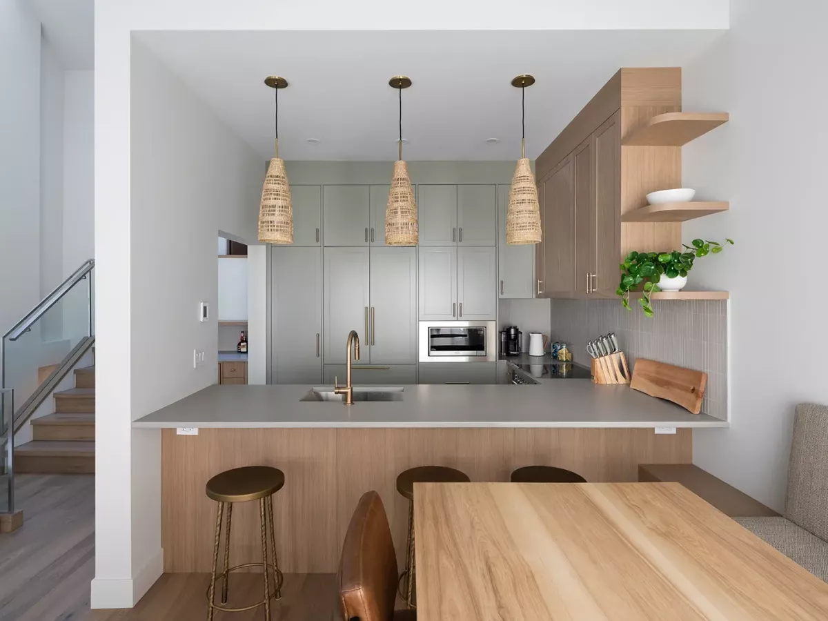 Whistler townhome kitchen with floor to ceiling cabinetry and a wrap-around island